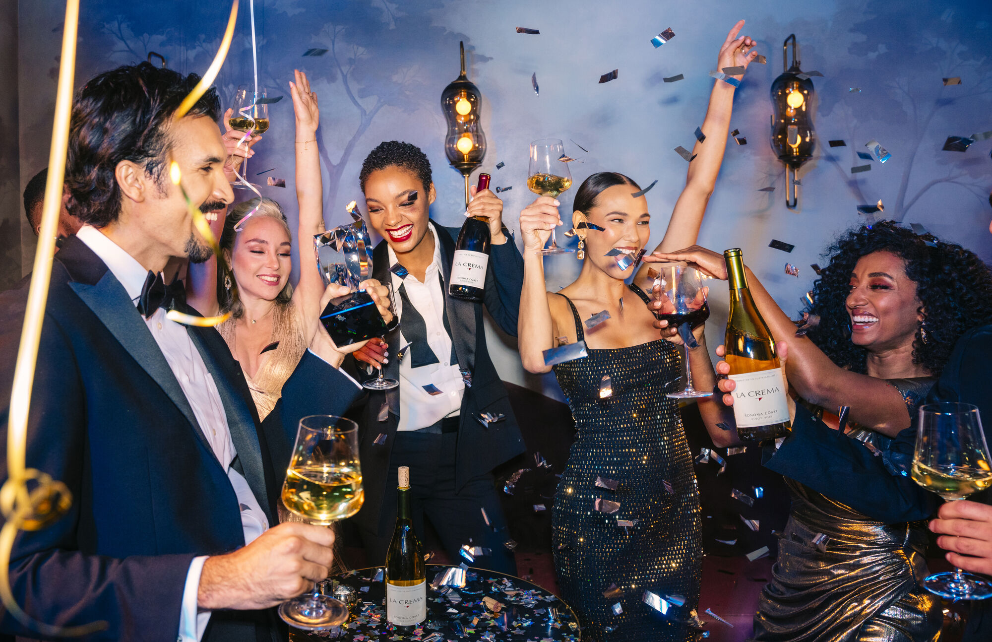 Man and woman enjoying a glass of chardonnay and pinot noir at La Crema's vineyard